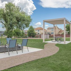 Outdoor firepit with seating at Parc at Prairie Grass, located in Colorado Springs, CO