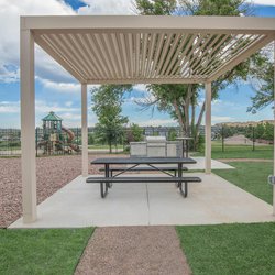 Pergola with outdoor dining stainess steel gas grill at Parc at Prairie Grass, located in Colorado Springs, CO