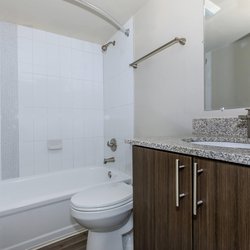 Secondary bathroom with modern finishes and brown cabients at Parc at Prairie Grass, located in Colorado Springs, CO
